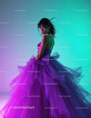 Elegant Woman in Vibrant Purple Tulle Gown with Colorful Lighting