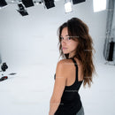 Fashion Portrait of a Woman with Wavy Hair in Studio Setting