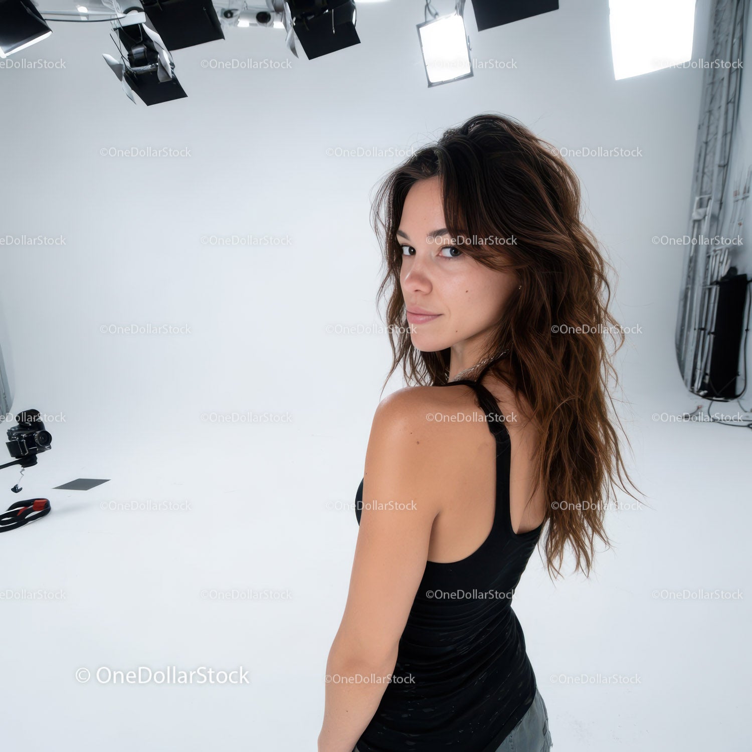 Fashion Portrait of a Woman with Wavy Hair in Studio Setting