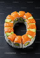 Fresh salmon and avocado sushi ring on black slate