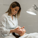 Relaxing Facial Treatment with Beauty Professional in Spa Setting