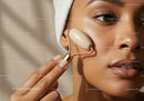 Close-up of Woman Using Jade Roller for Facial Skin Care