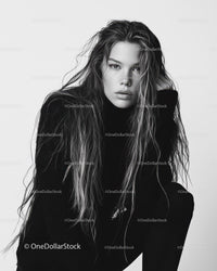 Black and White Portrait of a Woman with Wet Hair and Intense Gaze