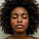 Beautiful Woman with Curly Hair Wearing Face Mask for Skin Care