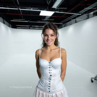 Young Woman Smiling in Studio with White Background