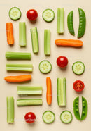 Fresh sliced vegetables arranged on light background