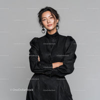 Elegant Young Woman in Black Dress with Crossed Arms Portrait