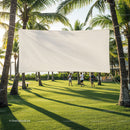 Blank Outdoor Movie Screen Between Palm Trees in Tropical Park