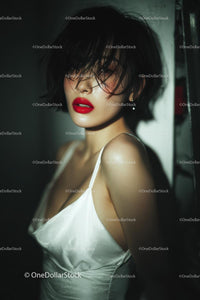 Elegant Woman with Red Lips in Stylish Evening Dress