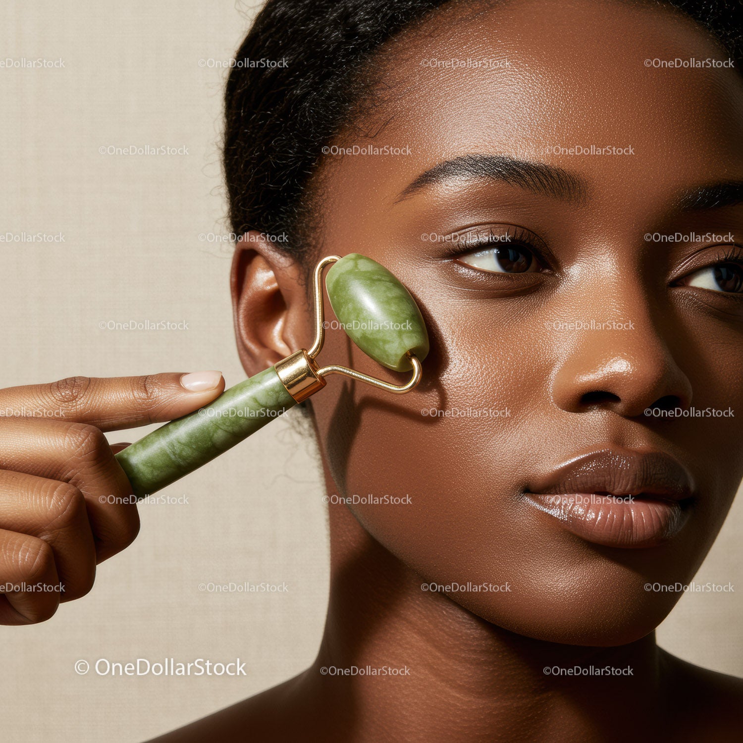Close-up of a Black Woman Using Jade Roller for Face Massage