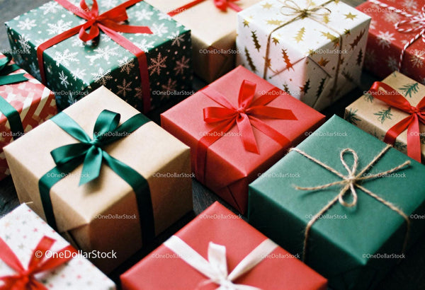 Festive wrapped gifts with elegant holiday ribbons