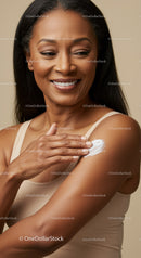Elegant Woman Applying Lotion on Shoulder for Beautiful Skin