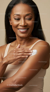 Elegant Woman Applying Lotion on Shoulder for Beautiful Skin