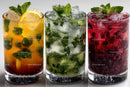 Colorful Fruit Cocktails with Mint Leaves and Ice Cubes