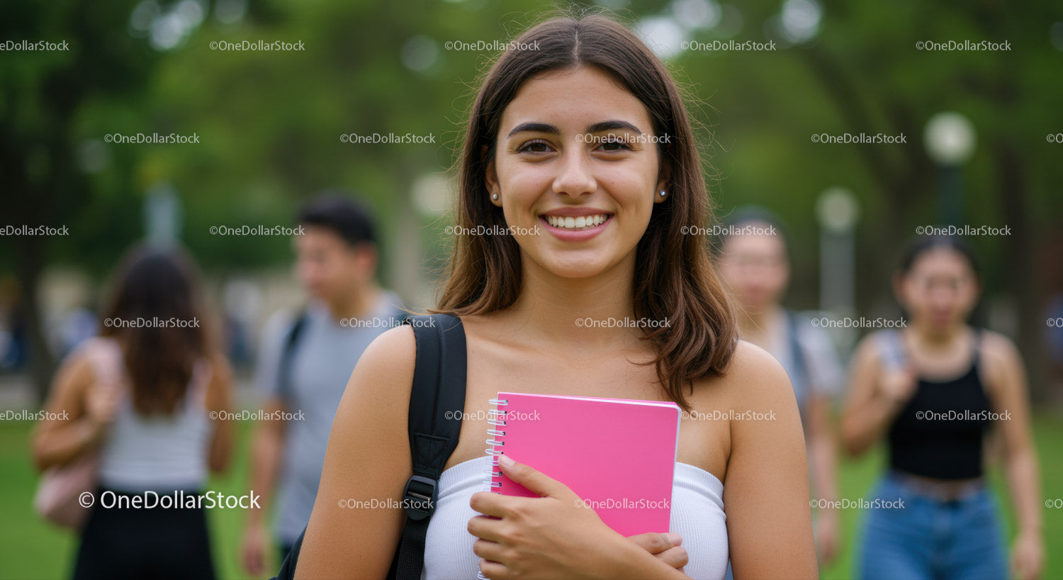 Smiling Young Woman with Backpack and Pink Notebook in Park