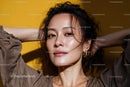 Young Woman with Stylish Look and Confidence in Studio