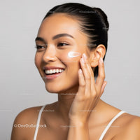 Young Woman Applying Skincare Cream for Radiant Skin