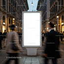 Empty illuminated billboard on busy city street in evening