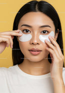 Young Woman Applying Eye Mask Skincare Treatment for Beautiful Skin