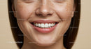 Close-up of smiling woman with natural freckles