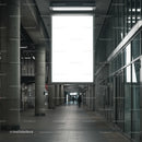 Empty urban corridor with large illuminated billboard
