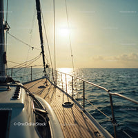 Scenic View of Yacht Sailing at Sunset Over the Ocean