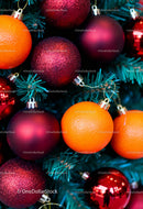 Christmas tree decorated with red baubles and fresh oranges
