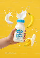Hand Holding Yogurt Drink with Fresh Bananas Splash