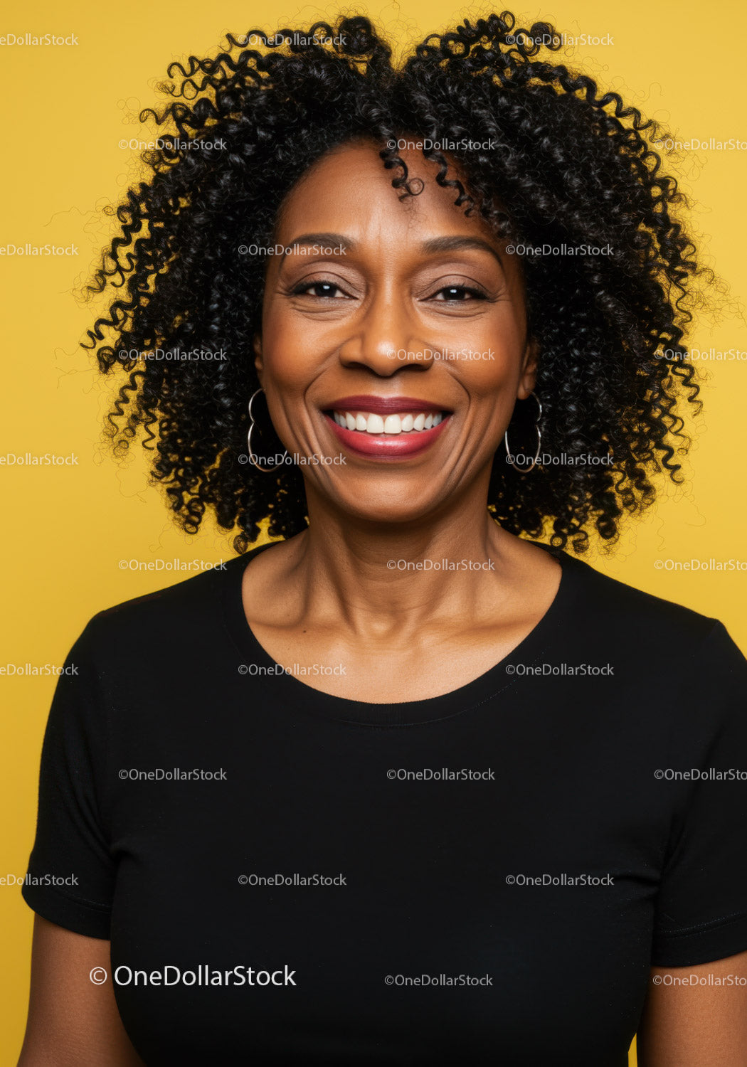 Joyful Black Woman with Curly Hair Smiling Portrait Against Yellow Background
