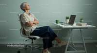 Thoughtful Woman Enjoying Peaceful Moment in Modern Office