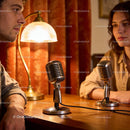 Two people recording podcast in warm cozy studio