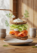 Fresh smoked salmon sandwich with cucumber and dill cream