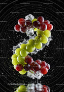 Fresh red and green grapes falling into water with ice