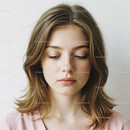 Young Woman with Shoulder-Length Hair and Soft Makeup in Peaceful Portrait