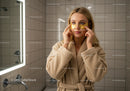 Young Woman Applying Under Eye Patches During Skincare Routine