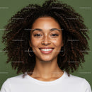 Portrait of a Smiling Woman with Curly Hair and Hoop Earrings