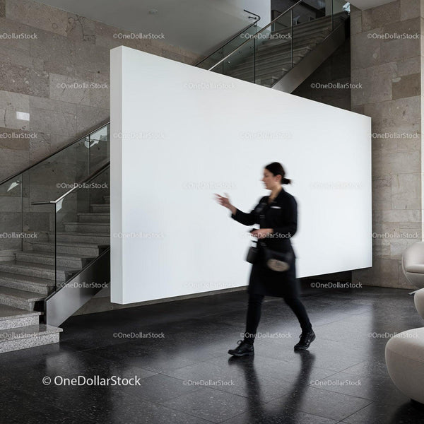 Blurred woman walking past modern white wall indoors JPG Mockup Image