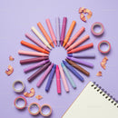 Colorful Crayons and Craft Supplies on Pastel Background