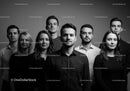 Confident young professionals standing together in studio