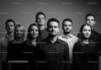 Confident young professionals standing together in studio