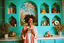 Joyful Woman Enjoying Tea in Bright Turquoise Kitchen with Decor