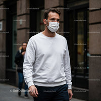 Man Wearing White Mask Walking in Urban Street