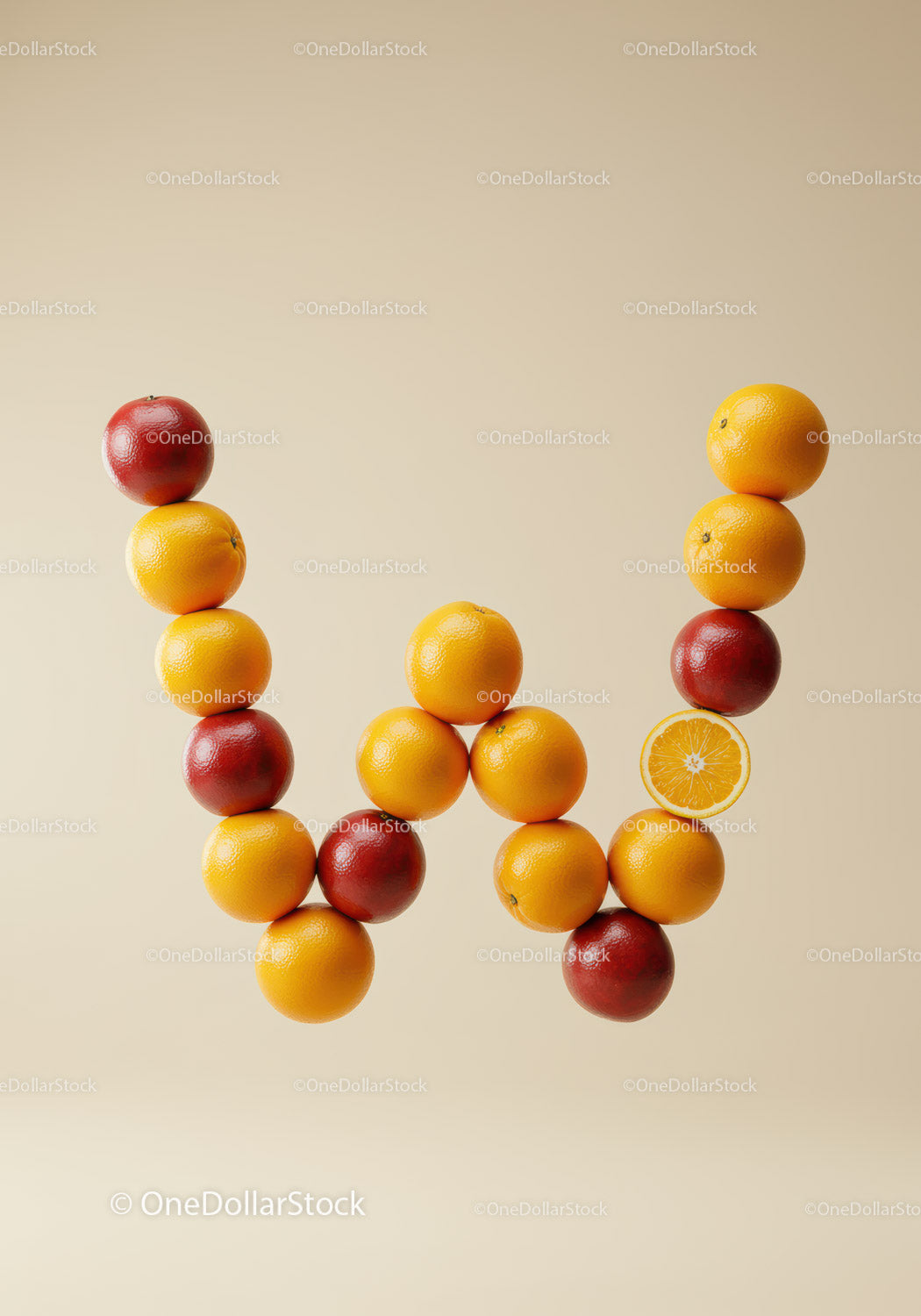 Stacked Citrus Fruits Creating The Letter W