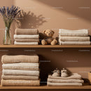 Cozy beige knits and baby shoes on wooden shelves