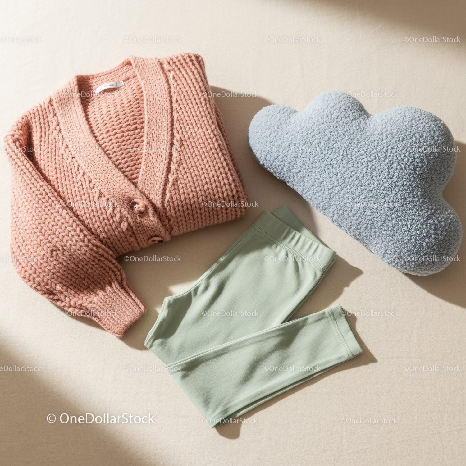 Cozy knitted sweater with soft leggings and cloud pillow