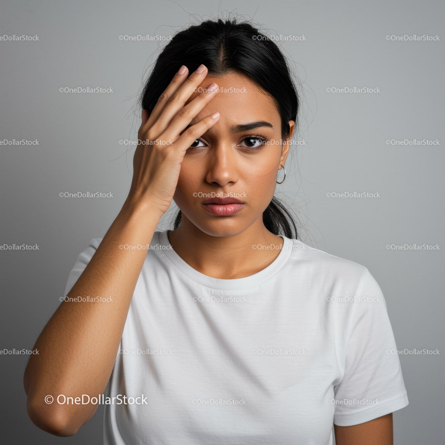Portrait of a Confident Young Woman Touching Her Forehead