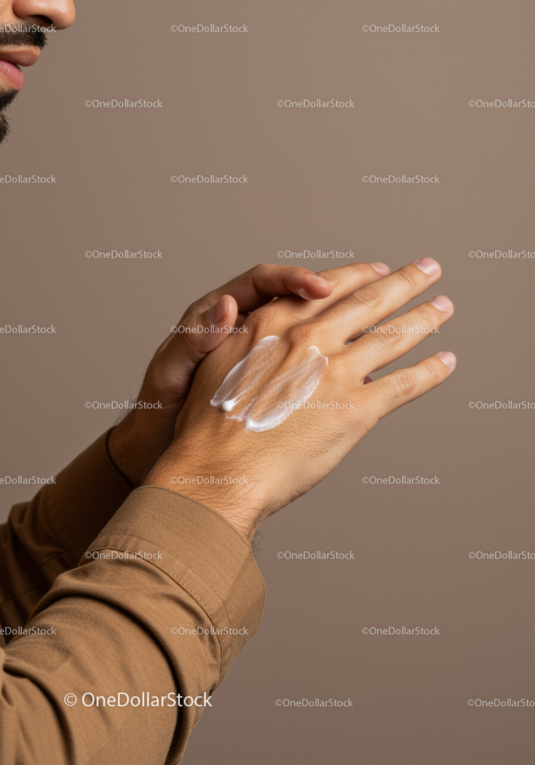 Close-Up of Hands Applying Lotion for Skin Moisturization and Care