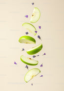 Floating green apple slices with scattered lavender flowers