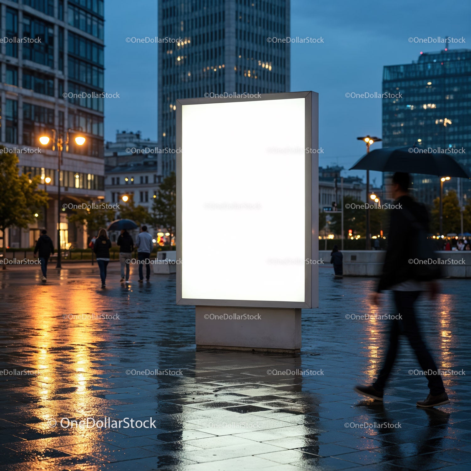 Blank illuminated billboard in rainy urban evening scene