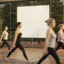 Group of women practicing yoga indoors near mirror